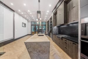 Modern kitchen with a large island and sleek cabinetry.