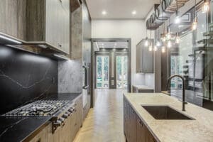 Modern kitchen with sleek appliances and island.