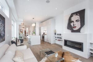 Bright, modern living room with white walls and wooden floor.