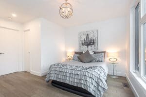 Cozy bedroom with modern decor and soft lighting.