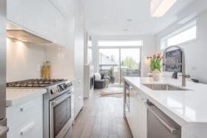 Bright, modern kitchen with stainless steel appliances and natural light.
