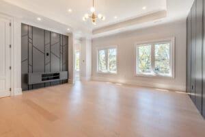 Bright, spacious living room with large windows and modern lighting.
