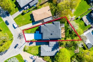 Aerial view of a residential property outlined in red.