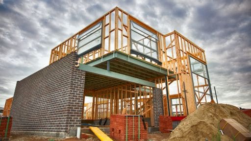 Wooden frame construction of a modern building in progress.